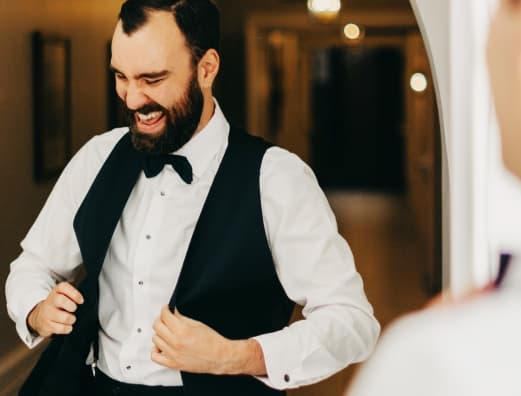 A waiter getting ready to dance through the dining room